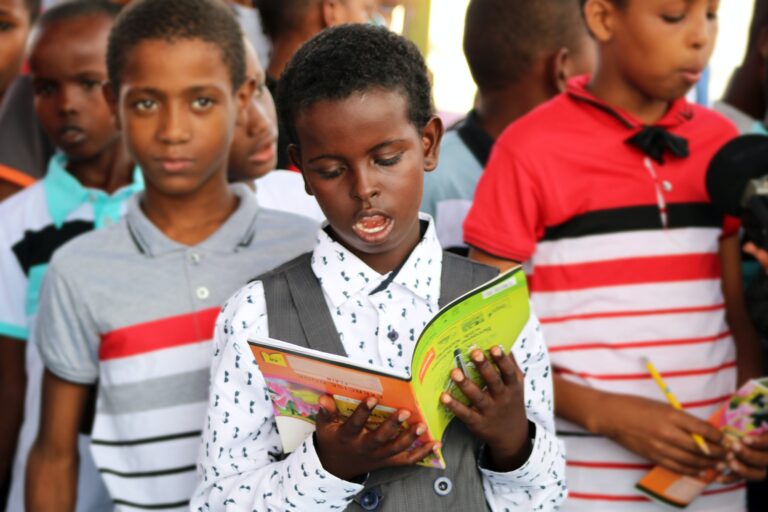 image - young boy reading book